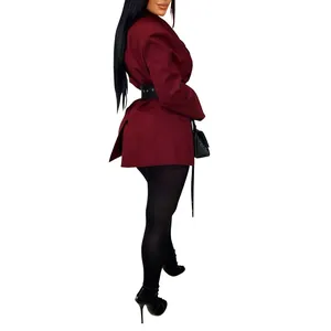 Side profile of a burgundy cinched-waist blazer jacket with black belt detail