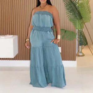 Stylish light blue strapless denim jumpsuit with wide leg and tiered ruffle detail.