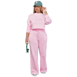 Full length view showing the fit of this pink long sleeve sweatshirt and wide-leg lounge set