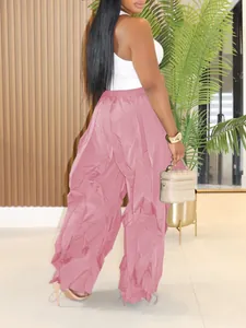 Back view of pink high-waisted wide-leg pleated trousers with a relaxed fit
