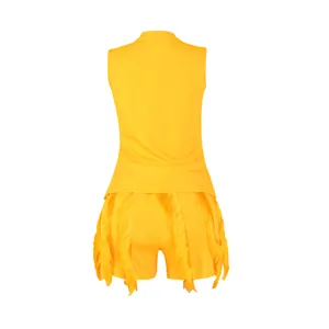 Rear view detail of a yellow two-piece set featuring fringe trim on shorts and tank top