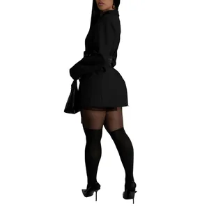Rear view of a chic black long-sleeved blazer dress with side buckle details