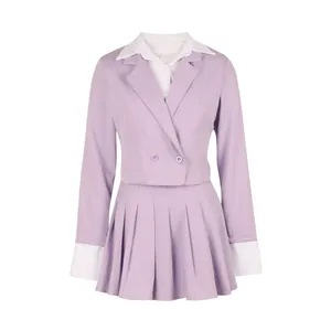 Detailed close-up view of lavender two-piece suit with cropped blazer and pleated skirt