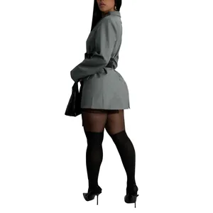 Side view of grey women's blazer jacket with lace-up waist and black accessories