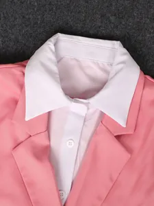 Close-up of pink office blazer lapel and white shirt collar detailing