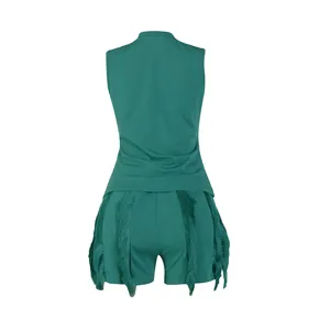 Back view showing the detail of a dark green summer fringe vest and shorts two-piece set
