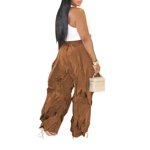 Back view of brown pleated wide-leg casual pants showing relaxed fit and textured fabric