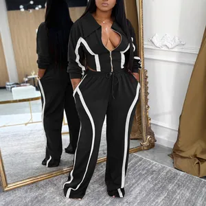Women's 2-piece black and white striped sports tracksuit with zip-up jacket and pants