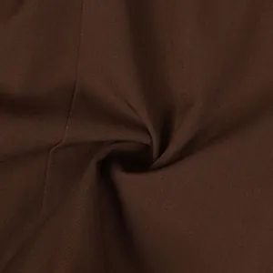 Macro view of brown twill suit jacket fabric texture showing fine weave detail