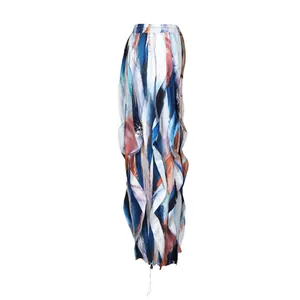 Detailed side view of loose wide-leg casual trousers with artistic pleated ruffle patchwork.