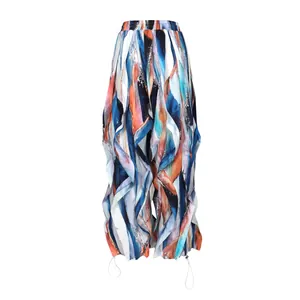 Detail shot of abstract print colorful wide-leg pleated trousers with ruffle design.