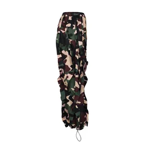 Detailed close-up of camouflage wide-leg cargo pants with unique ruffle side design