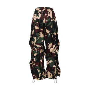 Detailed view of women's camo wide-leg trousers featuring unique ruffle drape design.