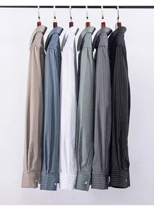 Selection of men's striped bamboo fiber shirts in various colors, hanging on a rack.