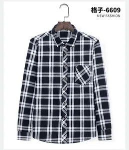 Classic men's black and white plaid brushed long-sleeved shirt on a wooden hanger