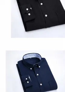Close-up of folded navy and black oxford shirts with striped collar details