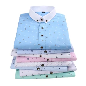 Folded stack of men's slim fit casual long sleeve shirts with anchor and dot patterns