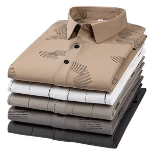 Stack of men's bamboo fiber long-sleeved shirts with geometric print in multiple colors.
