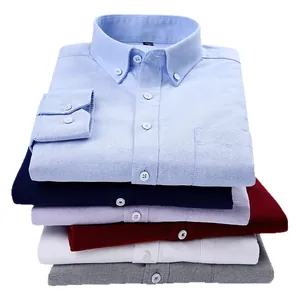 A stack of various colors of men's casual long-sleeve Oxford button-down shirts