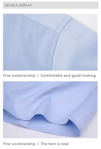 Detailed macro view showing the neat hem and shoulder seams of a light blue stretch shirt