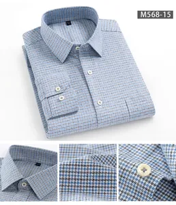 Primo piano della trama in cotone spazzolato e dei bottoni di una camicia a quadri blu.