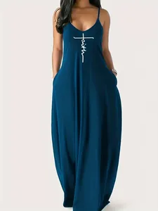 Macro view of elegant teal sleeveless maxi dress featuring a white faith cross print