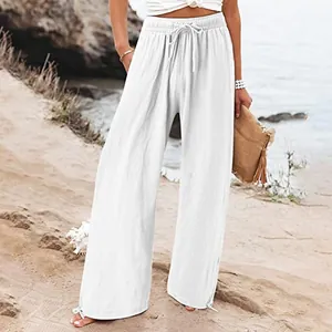 Witte broek met hoge taille en wijde pijpen met trekkoord voor casual strandkleding.