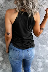Back view of women's minimalist black halter neck tank top paired with casual blue jeans