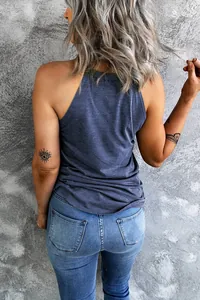 Back view of a stylish casual dark blue halter neck tank top paired with blue denim jeans