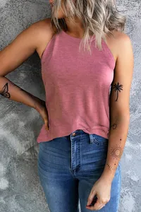 Close-up of a pink halter neck tank top featuring a textured fabric and casual summer style