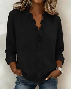Elegant black cotton linen blouse with romantic ruffle V-neck detail and long sleeves