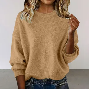 Detail of loose retro round neck sweater in soft camel knit fabric for women.