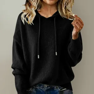 Close-up view of a women's stylish black loose hooded knit sweater with soft drawstrings