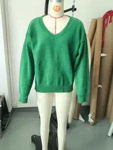 High-quality green V-neck long sleeve sweater displayed on a white mannequin torso