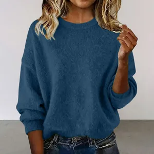 Close-up view of a soft navy blue knit sweater with a round neck and loose fit.