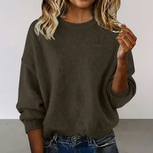 Detailed view of soft brown loose fit long sleeve sweater with a classic crew neck design