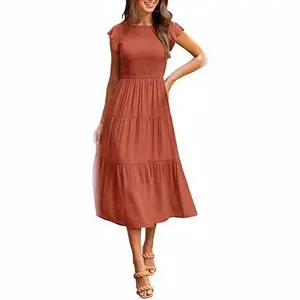 Elegant terracotta tiered midi dress with smocked bodice and ruffle cap sleeves for summer