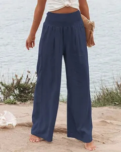 Vue détaillée du pantalon large en coton et lin bleu marine à taille haute élastique.
