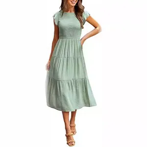 Elegant sage green flutter sleeve tiered midi dress with a smocked bodice for women
