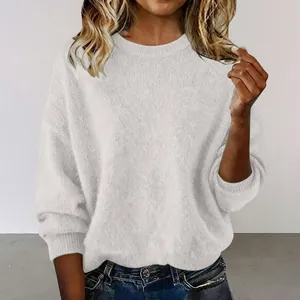 Close-up view of a soft white crew neck knit sweater featuring a loose vintage fit