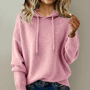 Detailed view of a soft pink hooded knit sweater with adjustable metal-tip drawstrings