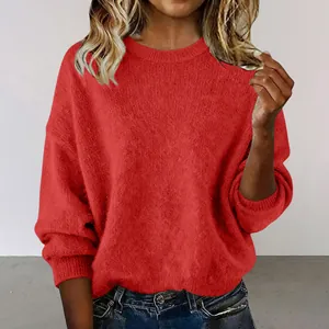 Close-up showing the vibrant red knit fabric and ribbed cuffs of this women's sweater