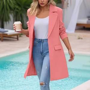 Stylish woman wearing a pink mid-length blazer with lapels at a resort poolside