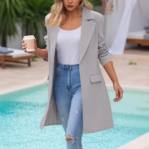 Elegant grey mid-length lapel blazer jacket for women in a leisure poolside setting