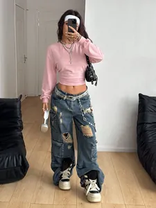 Full view of the slim fit pink cropped sweatshirt in a stylish Y2K mirror selfie