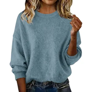Close-up detail of soft light blue crewneck knit sweater for women with a loose fit
