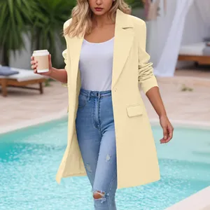 Detailed view of cream-colored long-sleeve lapel coat styled with denim jeans