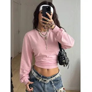 Detailed look at the pink Y2K cropped sweatshirt with slim fit and round neck design.