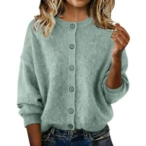 Detail view of a sage green knit cardigan for women with a round neck and buttons.