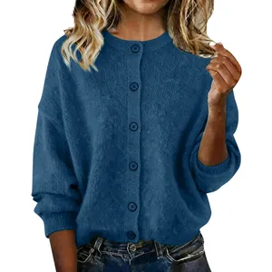 Detail view of a blue knitted button-down cardigan sweater for women in autumn style